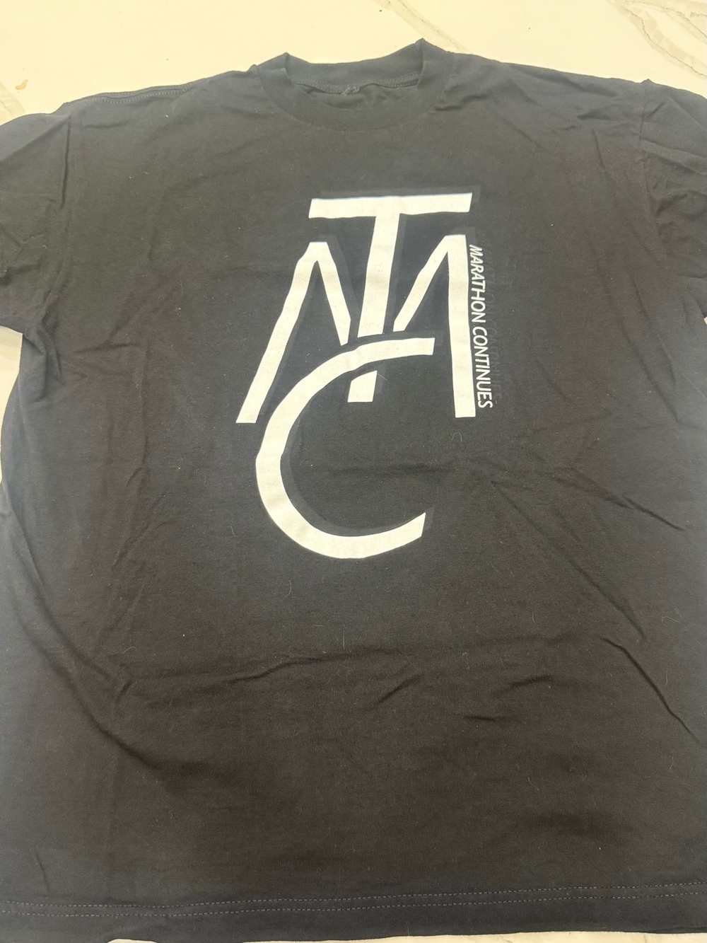 “The Marathon Continues” Crewneck Graphic Tee by Nipsey Hustle